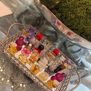 23  Mini Perfume Collectable  bottles some are full some empty  tray are include